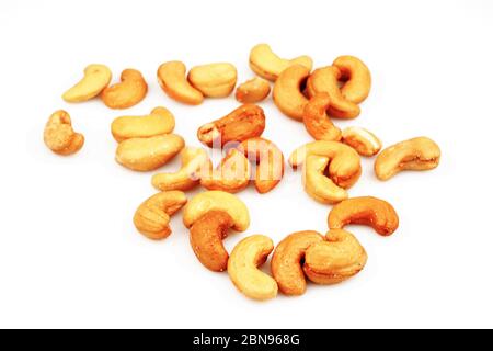 Unsalted roasted and salted organic cashew nuts isolated on white background, top view Stock Photo