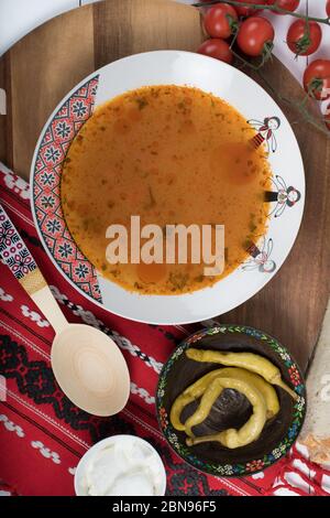 Top view of plate with meatballs soup, traditional plate of the Romanian cuisine, ciorba de perisoare Stock Photo