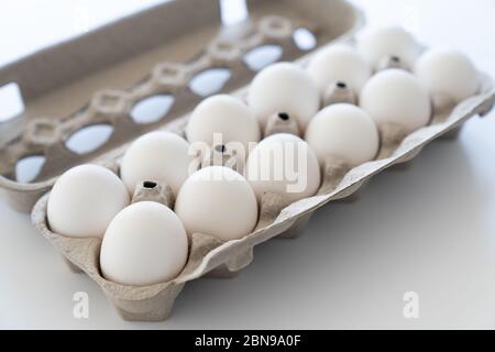 Twelve eggs in a carton package Stock Photo