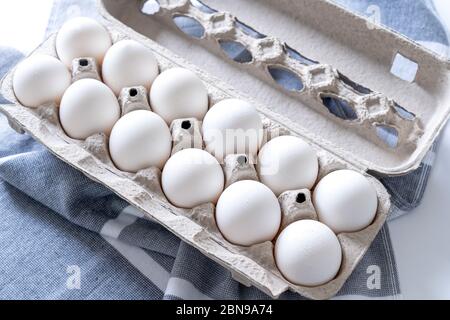 Twelve eggs in a carton package Stock Photo