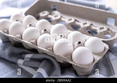 Twelve eggs in a carton package Stock Photo