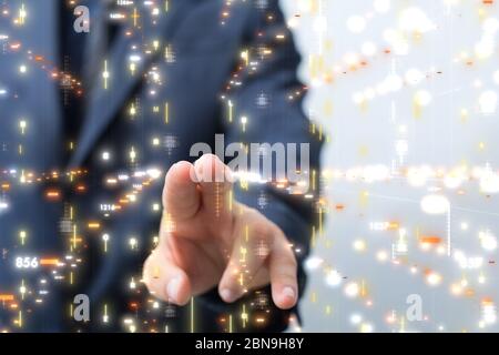 A Businessman pressing document icon over computer binary code Stock Photo