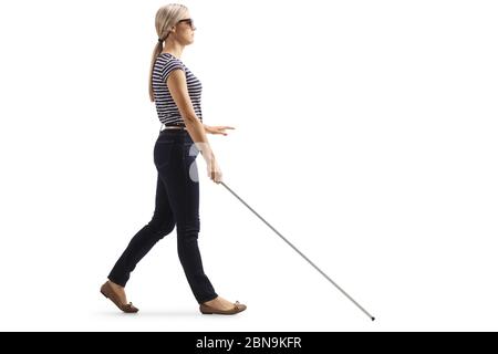 Full length profile shot of a young blind woman walking with a white cane  isolated on white background Stock Photo - Alamy