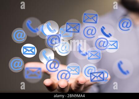 A Hand Touching Email With Finger Stock Photo