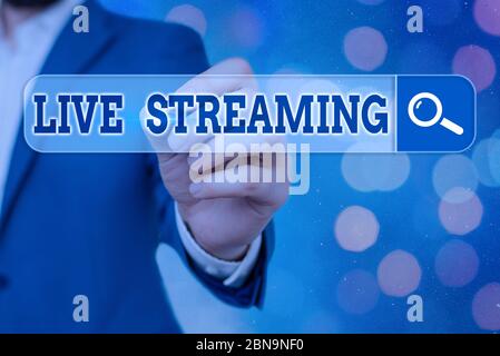 Handwriting text Live Streaming. Conceptual photo Transmit live video coverage of an event over the Internet Stock Photo