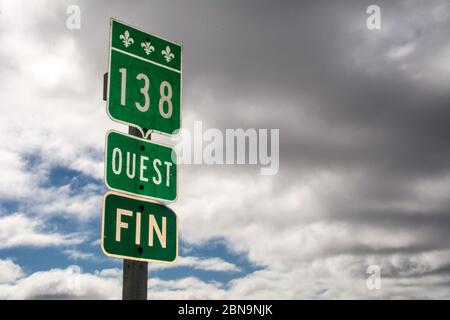 A French language road sign at the terminus of Highway 138 in the village of Old Fort, in the remote Lower North Shore region of Quebec, Canada. Stock Photo