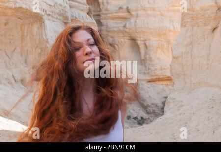 Red Haired Woman in Windy Canyon Stock Photo