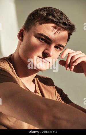 handsome young man in t-shirt and jeans  alone Stock Photo
