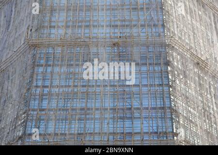 Hong Kong China - huge bamboo scaffold method on skyscraper Stock Photo