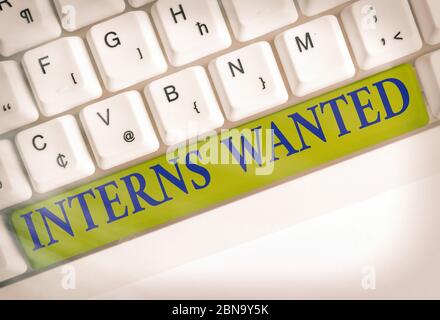 Conceptual hand writing showing Interns Wanted. Concept meaning Looking for on the job trainee Part time Working student Stock Photo