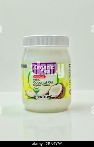 Coconut oil in a jar isolated on white background Stock Photo
