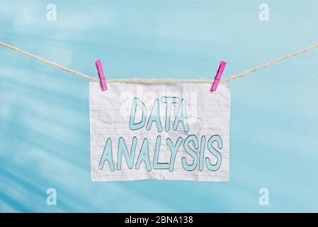Handwriting text Data Analysis. Conceptual photo Translate numbers to Analytical Conclusion Forecasting Clothesline clothespin rectangle shaped paper Stock Photo