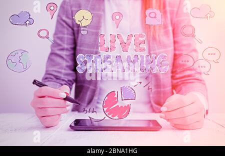 Handwriting text Live Streaming. Conceptual photo Transmit live video coverage of an event over the Internet Stock Photo