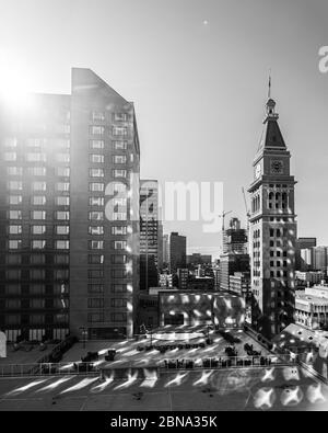 DENVER, UNITED STATES - Apr 05, 2020: Reflection of the sunrise off high rise towers in downtown Denver, Colorado Stock Photo