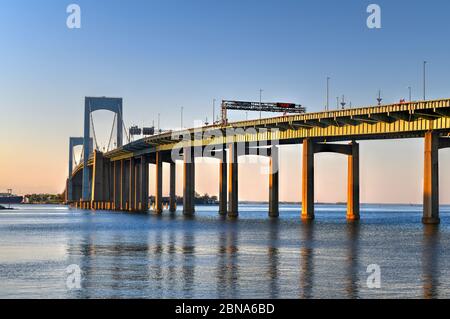 Aerial view of the Throgs Neck Bridge connecting the Bronx with Queens in New York City at sunset. Stock Photo