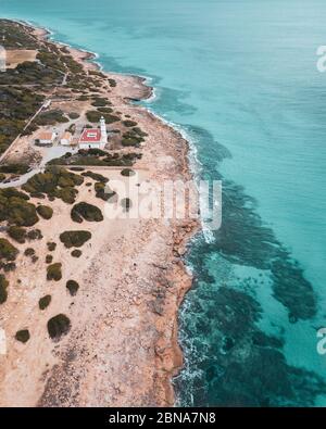 Astonishing vertical shot of the villa located on the shore of the sea Stock Photo