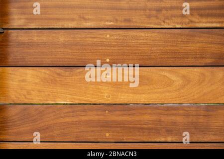 Wood floor background. Wooden flooring outdoors material, natural color planks with varnish, top view. Stock Photo