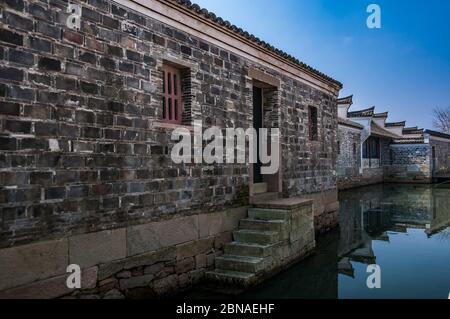 Buildings near the Eastern Small Gate with steps for access to boats on the waterway. Stock Photo