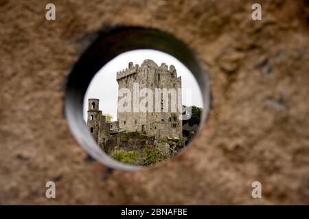 Beautiful shot of Blarney Castle in Ireland seen through the concrete hole