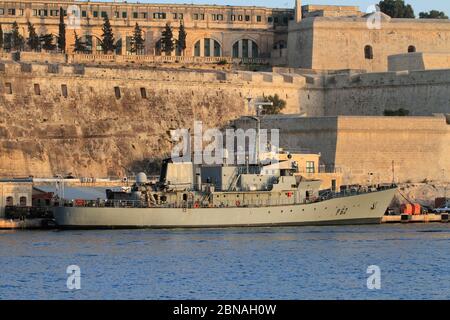 Armed Forces of Malta large patrol boat P62 moored at the AFM naval base at Hay Wharf, beneath the fortifications of Floriana Stock Photo