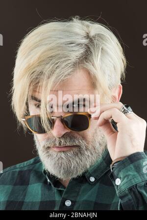 Successful middle eastern business man. Bearded stylish businessman. Serious face. Handsome young man on grey background looking at camera Stock Photo