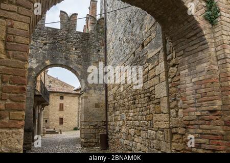 Vigoleno,Italy- July 22, 2018:View of the city walls and the entrance of Vigoleno, one of the most beautiful villages in Italy during a cloudy day. Stock Photo