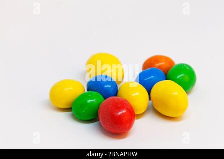 candy eggs in different colors before Easter Stock Photo