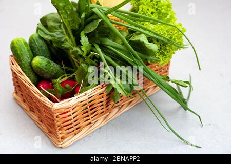 Lollo Bionda Lettuce. Delivery of products. A set of greens for salad. Chives, lettuce, cucumbers, radishes, spinach, arugula. Isolated on a white Stock Photo