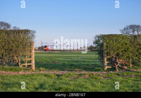 Virgin Trains Bombardier class 221 diesel voyager train passing the countryside at Brock on the west coast mainline in Lancashire Stock Photo