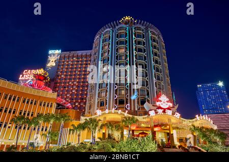 Hotel Lisboa illuminated at night. Macau, China. Stock Photo