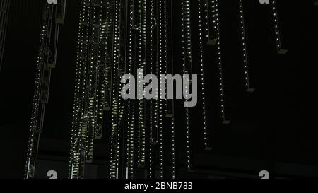 Lines with green light dots on a black background Stock Photo