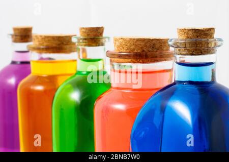Coloured bottles in white background Stock Photo