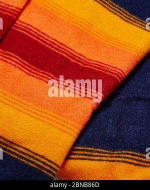 Closeup shot of a folded colorful wool blanket textile Stock Photo