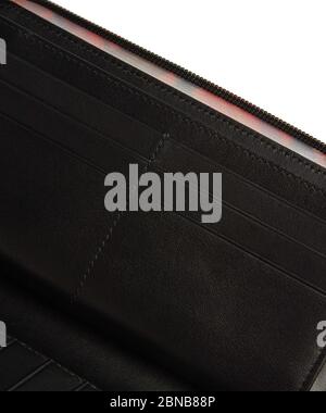 Closeup shot of the inner pockets of an open black wallet Stock Photo