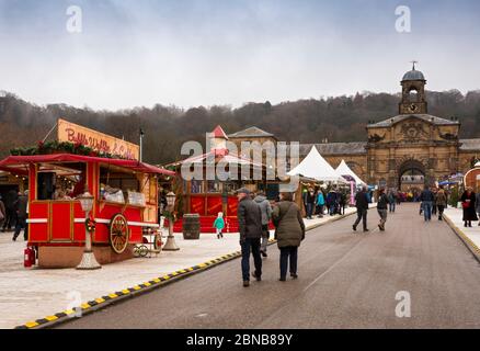 UK, England, Derbyshire, Edensor, Chatsworth House, Christmas Market visitors on road to Stables at waffle stall Stock Photo