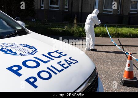 Edinburgh, Scotland, UK. 14 May 2020. Police and forensic team attend a crime scene at address in Restalrig area of Edinburgh following a serious assault at a property in Hawkhill Avenue in the east of the city. The  incident happened around 10.30pm on Wednesday, 13 May, 2020 and a 27-year-old man was taken to Edinburgh Royal Infirmary for treatment for his injuries.  Iain Masterton/Alamy Live News Stock Photo