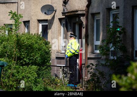 Edinburgh, Scotland, UK. 14 May 2020. Police and forensic team attend a crime scene at address in Restalrig area of Edinburgh following a serious assault at a property in Hawkhill Avenue in the east of the city. The  incident happened around 10.30pm on Wednesday, 13 May, 2020 and a 27-year-old man was taken to Edinburgh Royal Infirmary for treatment for his injuries.  Iain Masterton/Alamy Live News Stock Photo