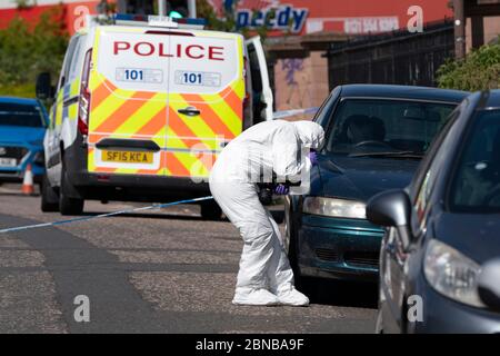 Edinburgh, Scotland, UK. 14 May 2020. Police and forensic team attend a crime scene at address in Restalrig area of Edinburgh following a serious assault at a property in Hawkhill Avenue in the east of the city. The  incident happened around 10.30pm on Wednesday, 13 May, 2020 and a 27-year-old man was taken to Edinburgh Royal Infirmary for treatment for his injuries.  Iain Masterton/Alamy Live News Stock Photo