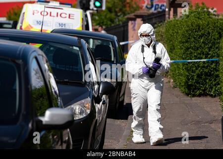 Edinburgh, Scotland, UK. 14 May 2020. Police and forensic team attend a crime scene at address in Restalrig area of Edinburgh following a serious assault at a property in Hawkhill Avenue in the east of the city. The  incident happened around 10.30pm on Wednesday, 13 May, 2020 and a 27-year-old man was taken to Edinburgh Royal Infirmary for treatment for his injuries.  Iain Masterton/Alamy Live News Stock Photo