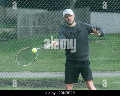 WIMBLEDON LONDON, 14 May 2020. UK.Tennis During Lockdown: People playing tennis outdoors at the Wimbledon Park tennis courts following government advice that lockdown rules have been relaxed for a number of sport including  golf and tennis while keeping social distancing of two metres apart . Credit: amer ghazzal/Alamy Live News Stock Photo