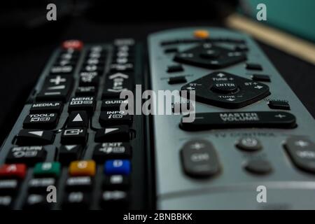 Closeup shot of the TV remote controls on a table Stock Photo