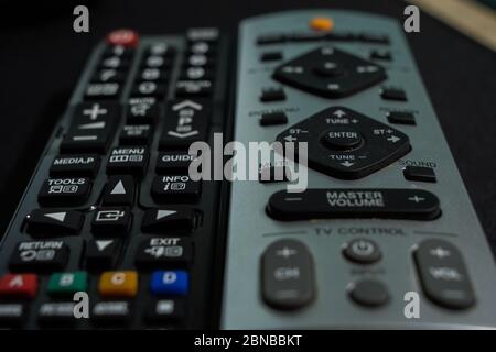 Closeup shot of the TV remote controls on a table Stock Photo
