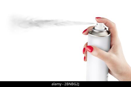 Woman spraying paint from can on white background. Aerosol spray can, metal bottle, paint can. Isolated on white background. With clipping path Stock Photo