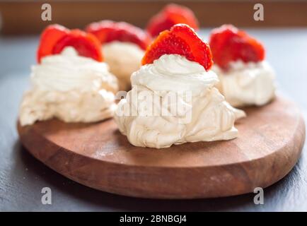 gourmet dessert pavlova strawberry on a blue background Stock Photo