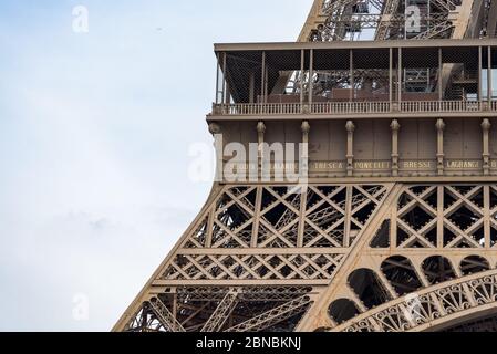 Close up detail view of the Eiffel tower on a sunny summer day. It is the tallest structure in Paris, France and the most-visited paid monument. Stock Photo