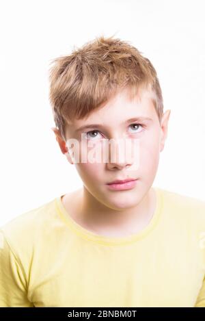 Emotional portrait of a 10-12 years boy. Emotional Portrait of sadness, depression and anxiety. Stock Photo