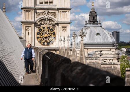 Clerk of the Works Ian Bartlett inspects the main nave roof near the Hawksmoor Towers at Westminster Abbey in London, where a small, dedicated team remains on site in order to care for the 750-year-old building while it is closed during the coronavirus crisis. Stock Photo