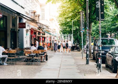 Berlin, Germany - July 27, 2019: Street view with sidewalk restaurants in Scheunenviertel quarter in Berlin Mitte. It is one of oldest and most charis Stock Photo