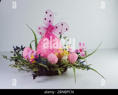 Pink decorative eggs and a butterfly for easter Stock Photo