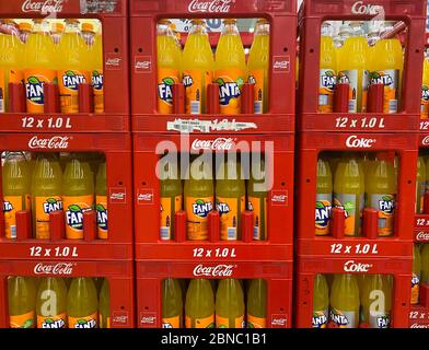 Tönisvorst, Germany - May 14. 2020: View on isolated stacked red Coca Cola Fanta cases in german supermarket Stock Photo